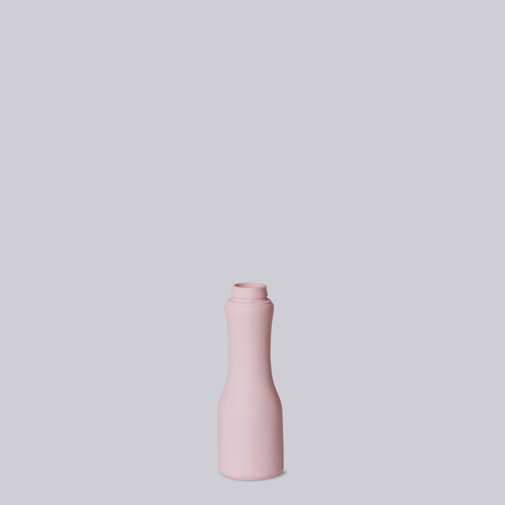 Pink bottle on a light gray background