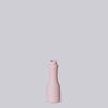 Pink bottle on a light gray background