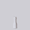 White ceramic vase on a light gray background