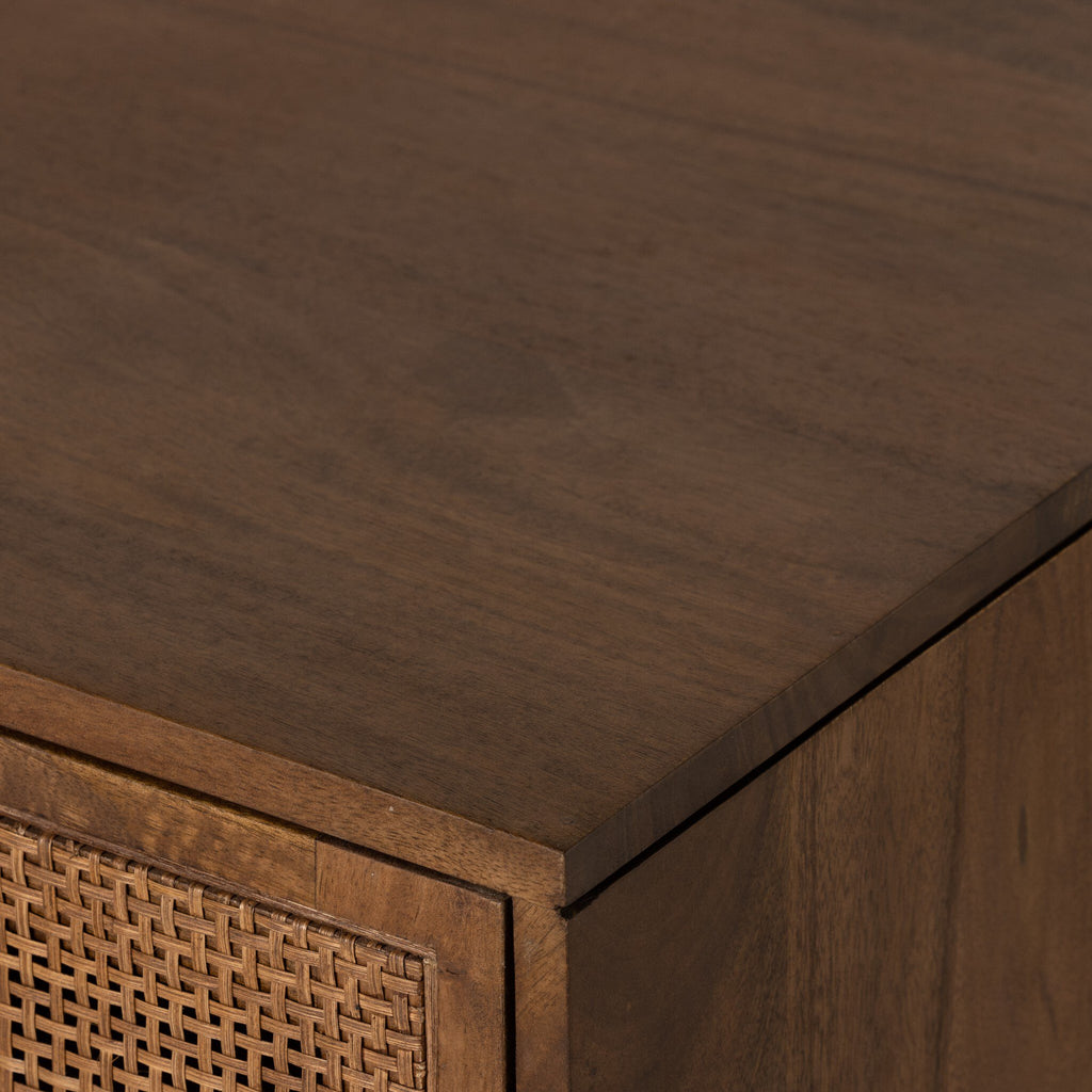 Close-up of a wooden cabinet with wicker texture