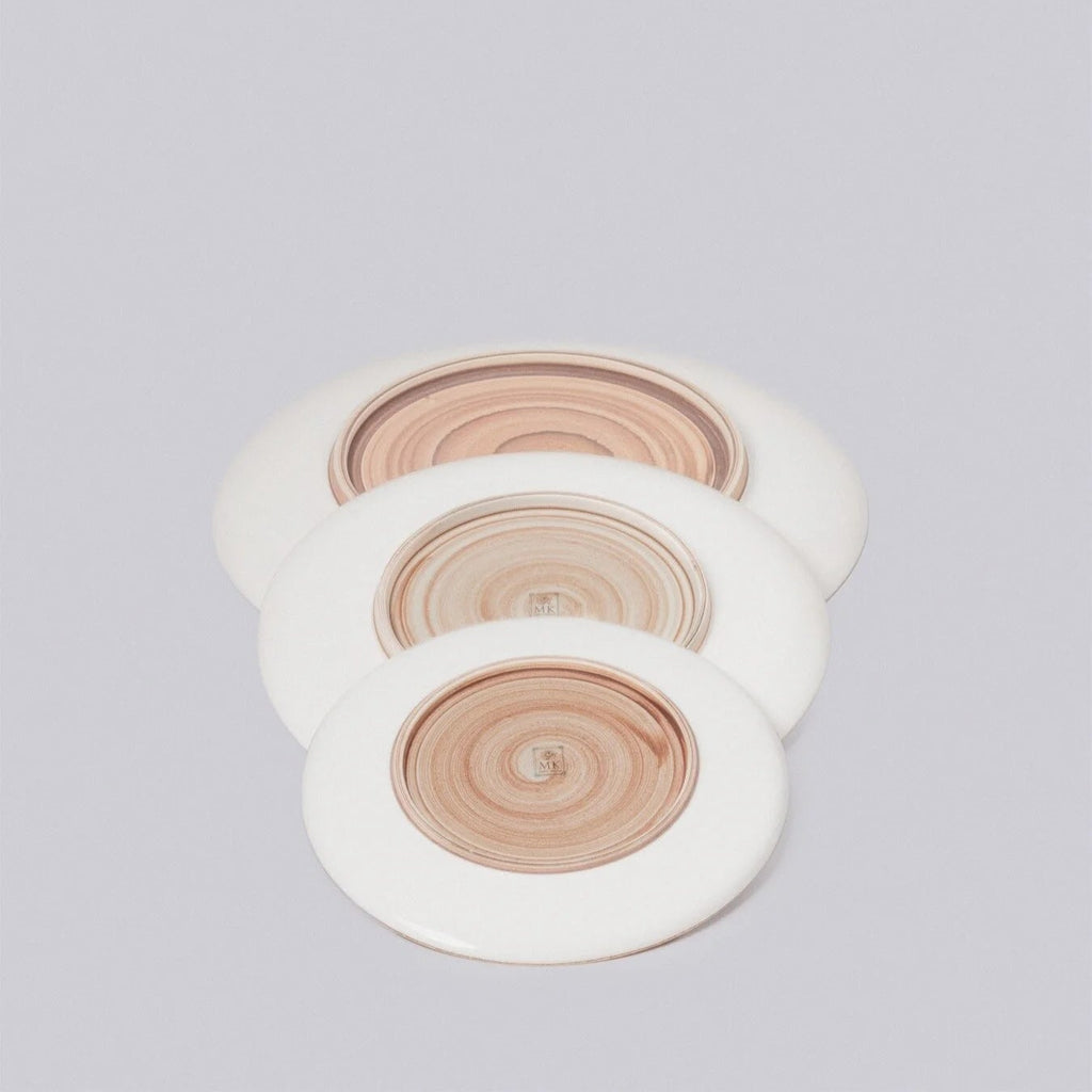 Set of three wooden coasters with white rims on a light gray background