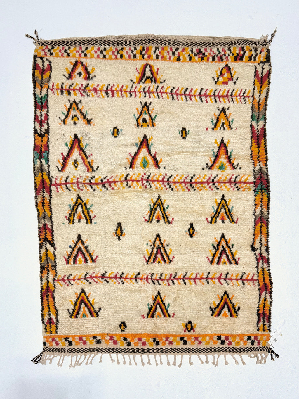 Decorative rug with geometric pattern on a white background