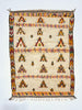 Decorative rug with geometric pattern on a white background