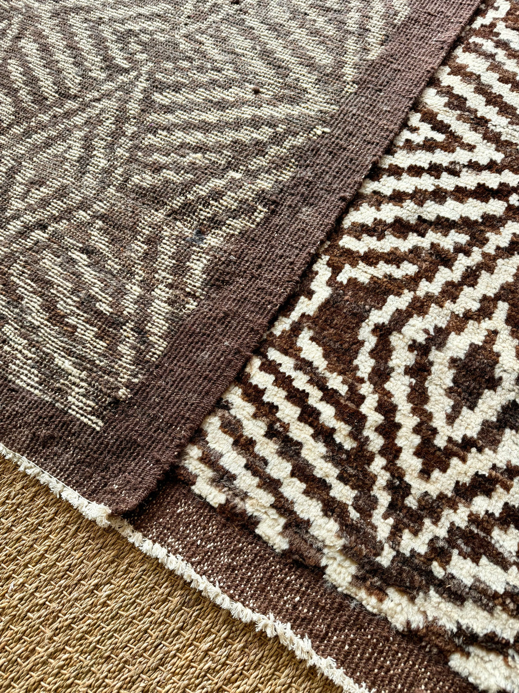 Close-up of a brown and beige patterned rug