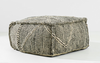 Textured ottoman with woven pattern on a white background