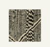 Close-up of a textured fabric with black and white pattern on a light gray background