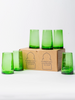 Set of green glass tumblers with a cardboard box labeled 'Moroccan Glassware' on a white background.