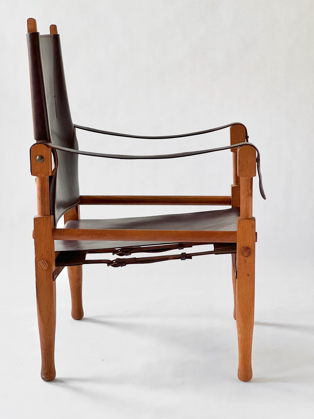 Wooden chair with leather seat and backrest on a white background