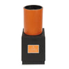 Orange leather container on a black box 