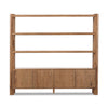 Wooden bookshelf with four shelves and two doors on a white background