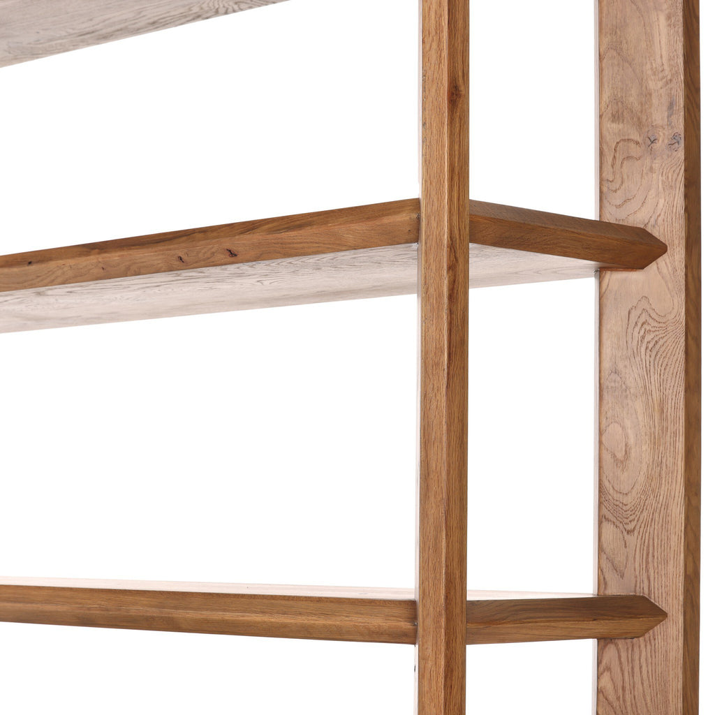 Wooden shelf with three shelves on a white background