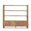 Wooden bookshelf with four shelves and a cabinet below on a white background