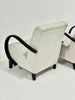 Beige armchair with black armrests on a white background