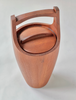 Wooden trash can with a lid and handle on a white background