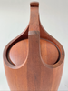 Wooden vase with a handle on a white background