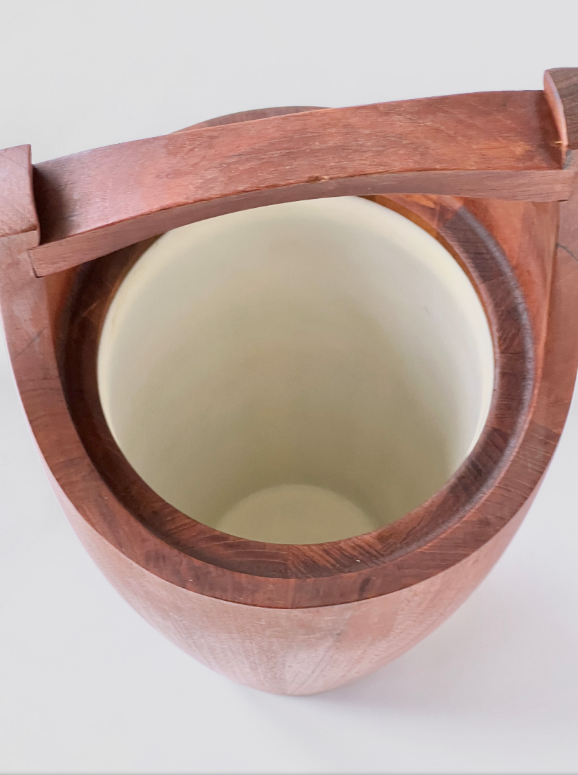 Wooden container with a lid on a white background