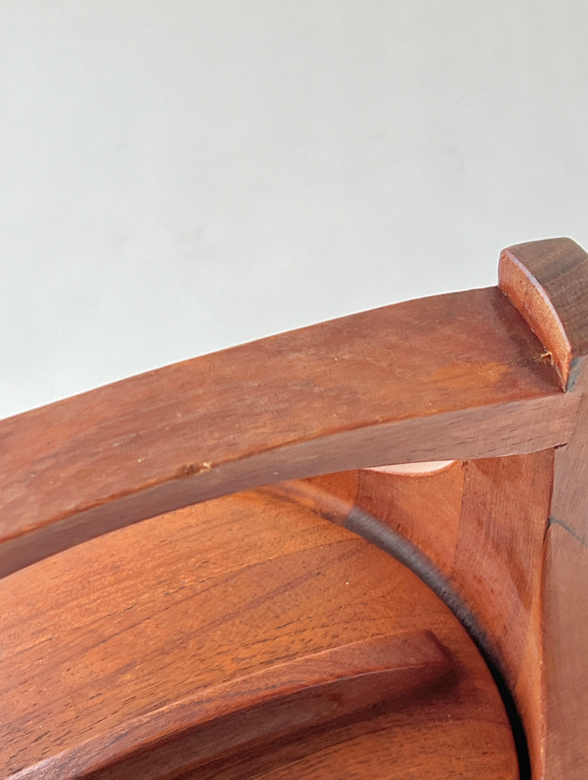 Close-up of a wooden handle with a plain background