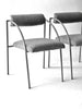 Two gray chairs with metal frames on a white background