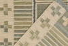 Close-up of two patterned rugs with geometric designs.