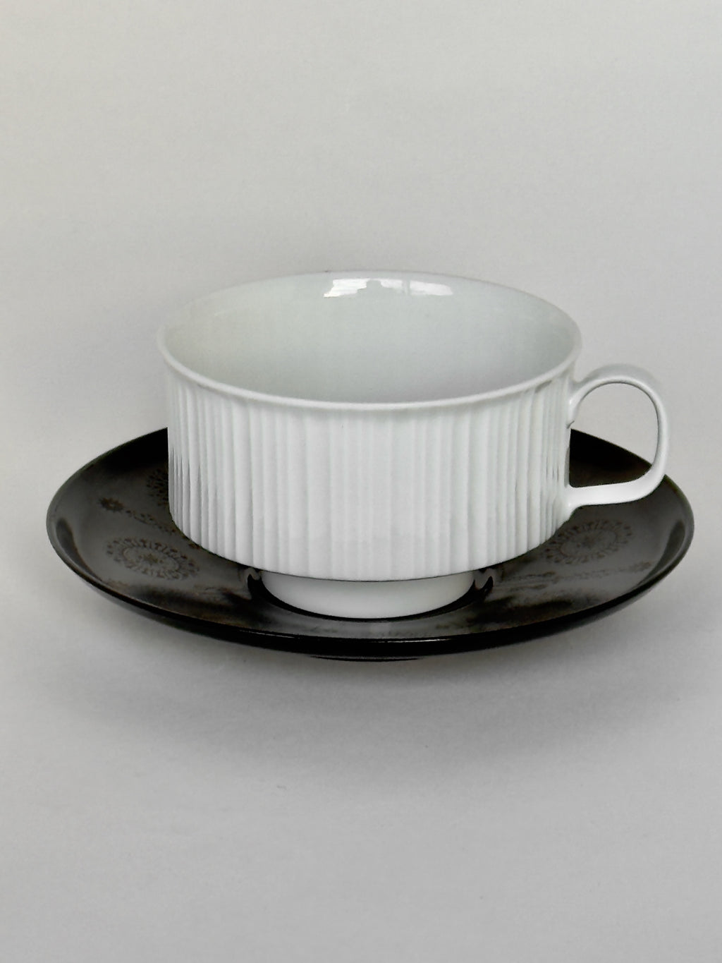 White ceramic cup and saucer 