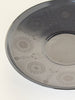 Decorative ceramic plate with floral patterns on a white background