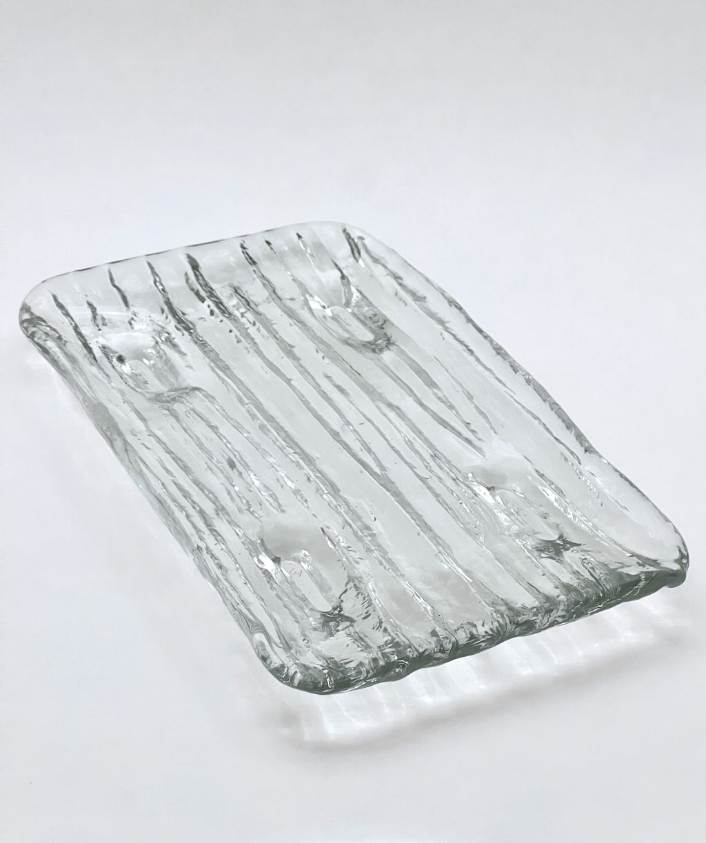 Rectangular glass tray with textured surface on a white background