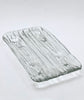 Rectangular glass tray with textured surface on a white background