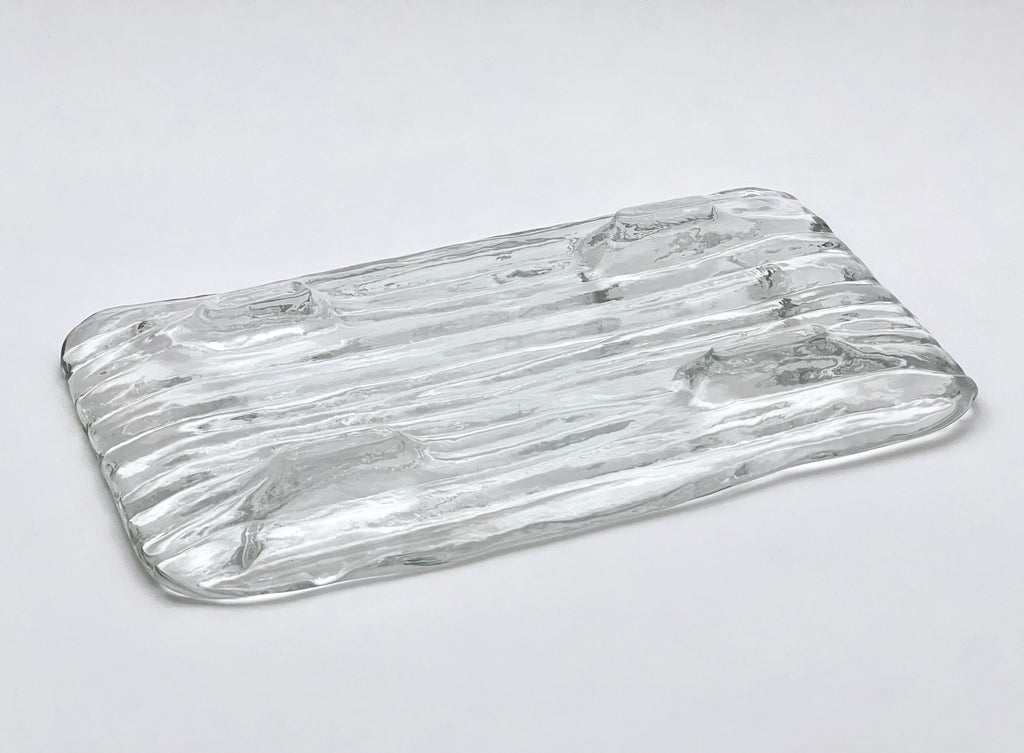 Clear glass tray with wavy design 