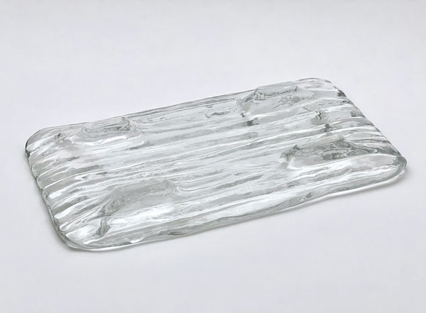 Clear glass tray with wavy design 