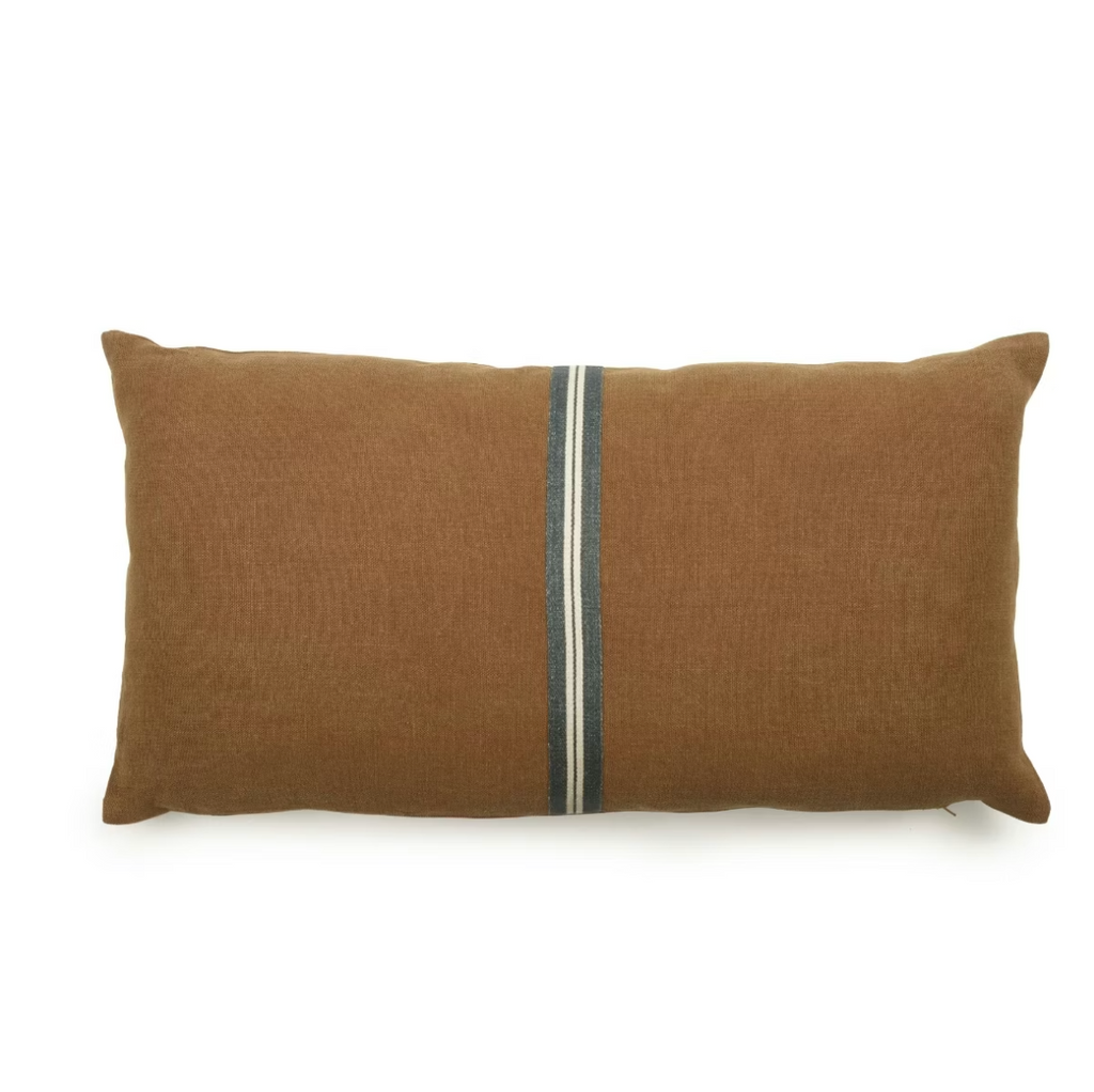 Brown linen pillow with a central stripe on a white background