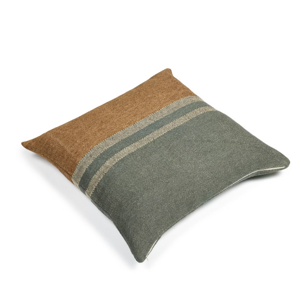 Two-toned brown and gray pillow on a white background