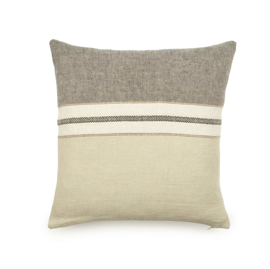 Two-toned pillow with gray top and beige bottom on a white background