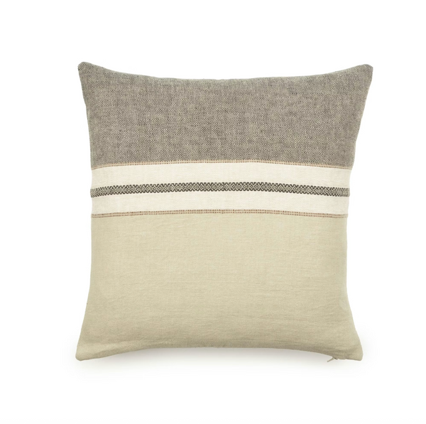 Two-toned pillow with gray top and beige bottom on a white background