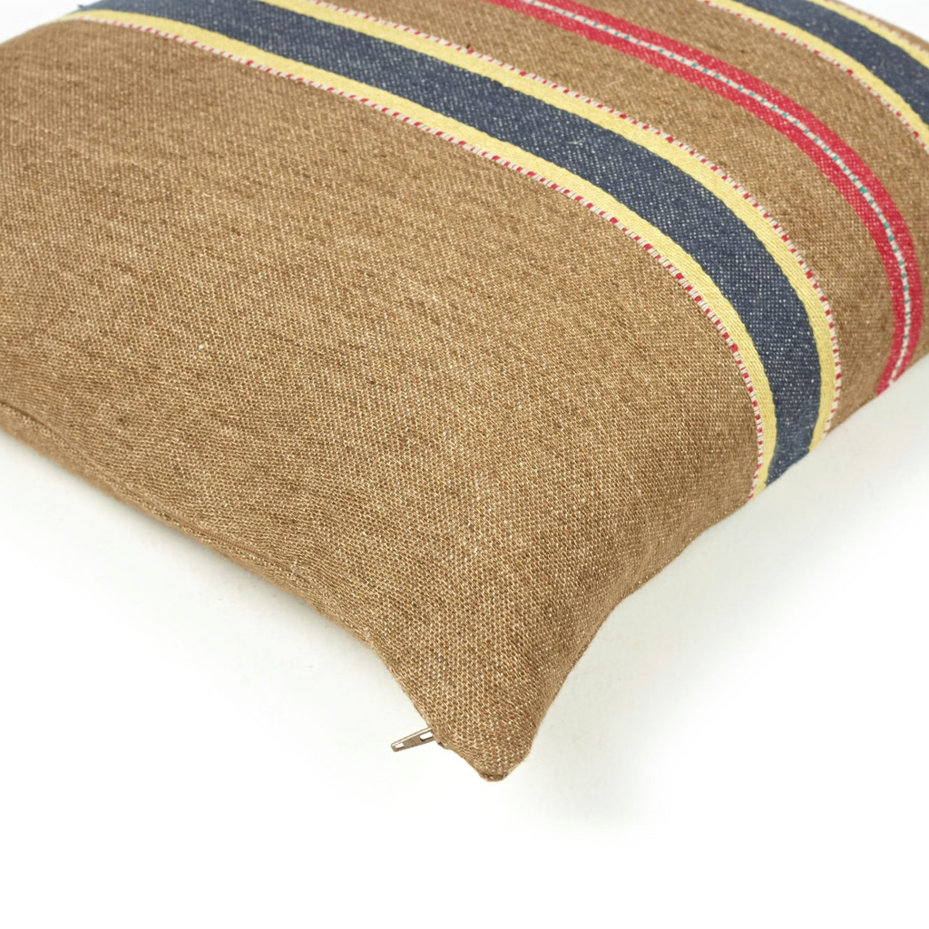 Textured pillow with striped pattern on a white background