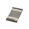Gray towel blanket with white stripes and fringes on a white background