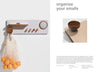 Wall-mounted organizer with hooks and a wooden bowl on a light gray background