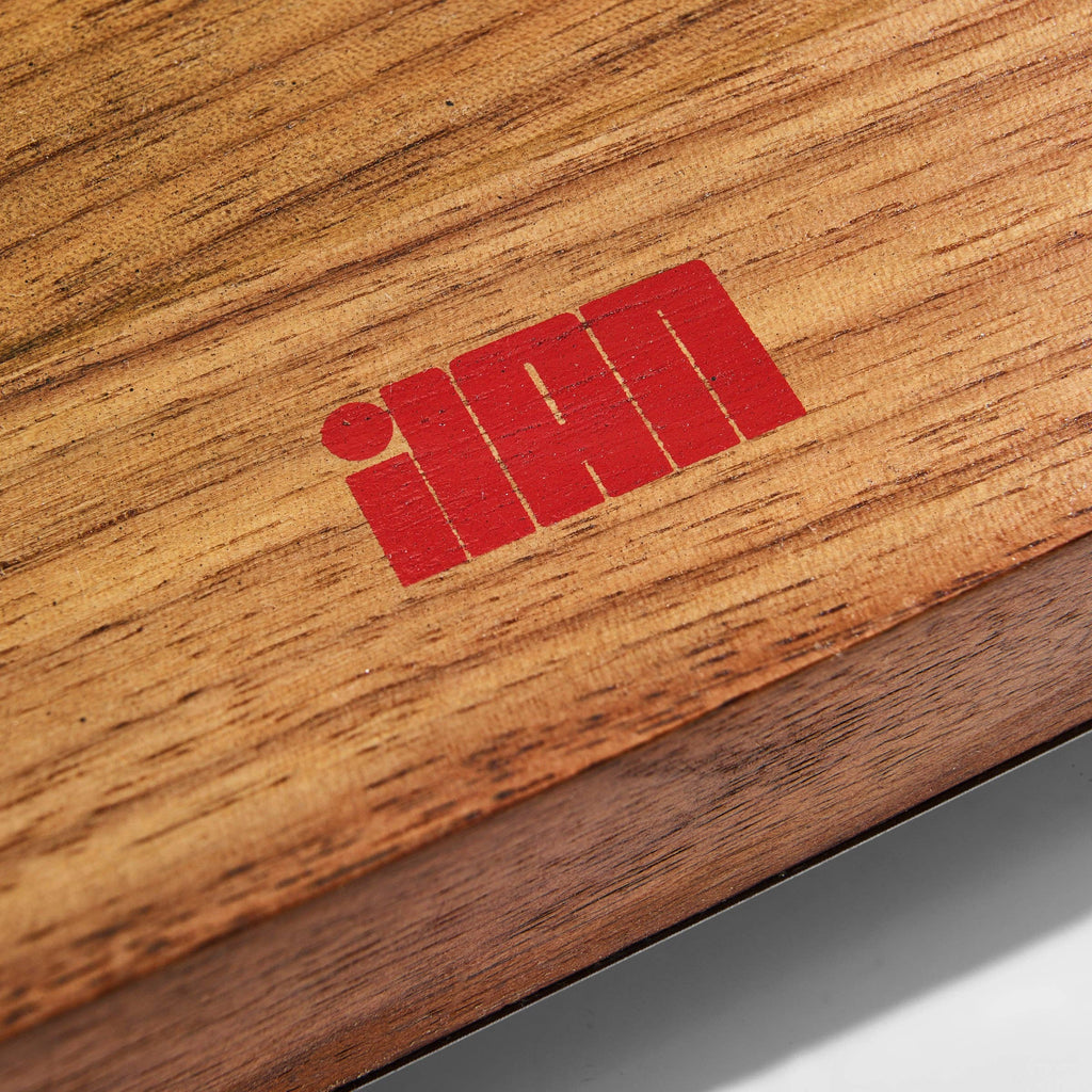 Red logo on a wooden surface