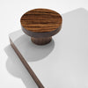 Wooden hook on a white surface