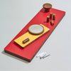Colorful wooden shelf with cylindrical objects on a light gray background
