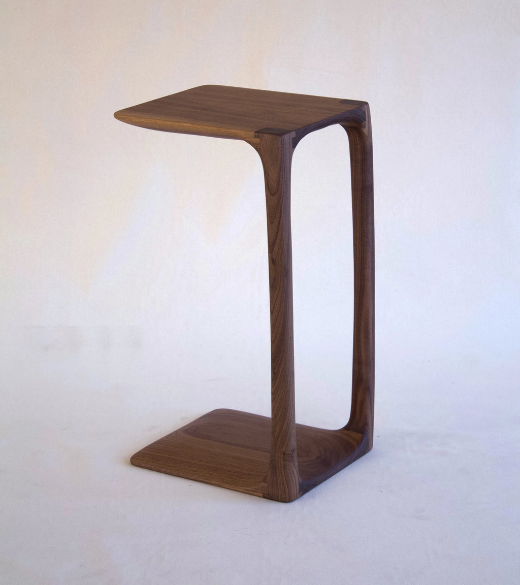 Wooden side table on a white background