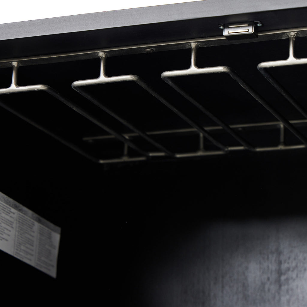 Close-up of a black wood cabinet with glassware storage