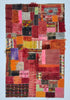 Multicolored patchwork rug with various textures on a light blue background