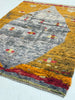 Multicolored textured rug with geometric pattern on a white background