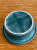 Stack of blue ceramic bowls on a wooden surface