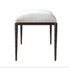 Stool with white cushioned seat and dark wooden legs on a white background