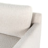 Close-up of a textured gray sofa corner on a white background