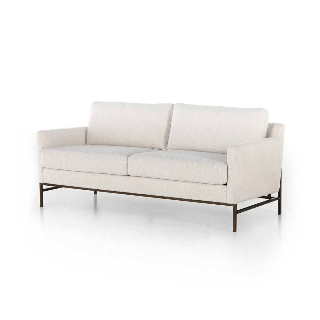Beige sofa with metal frame on a white background