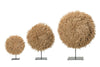 Three decorative spherical objects on stands against a white background