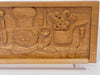 Wooden carving of kitchen utensils and items on a stand