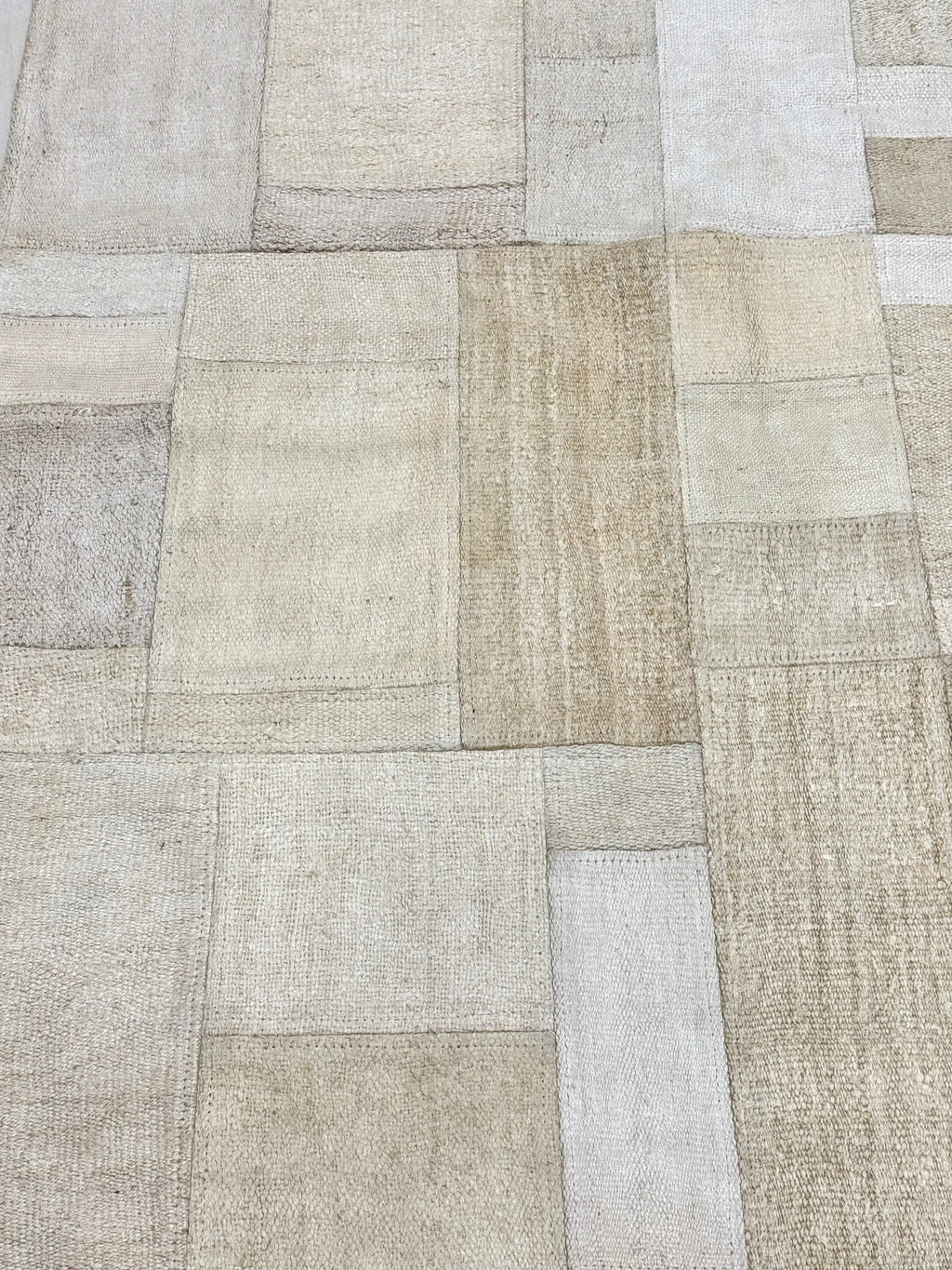 Textured patchwork pattern with beige and brown tones